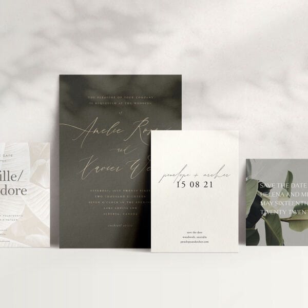 A green and white set of wedding stationery with leaves